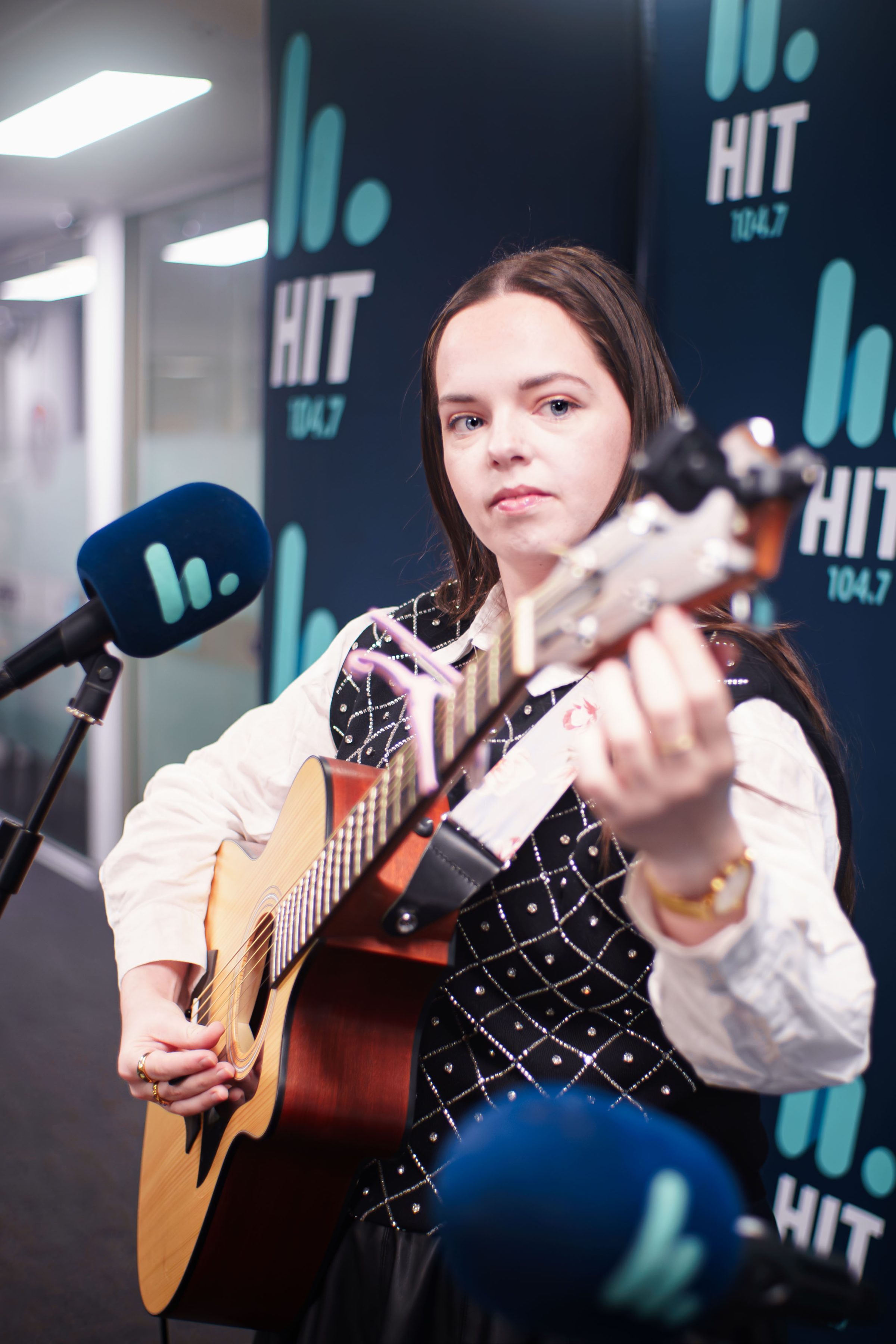 Sophie Edwards at Hit 104.7 Sophie Edwards tuning her guitar just prior to her live perfromance at Hit 104.7 HQ